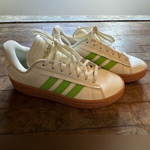 Adidas, women’s size 6, cream and green.
